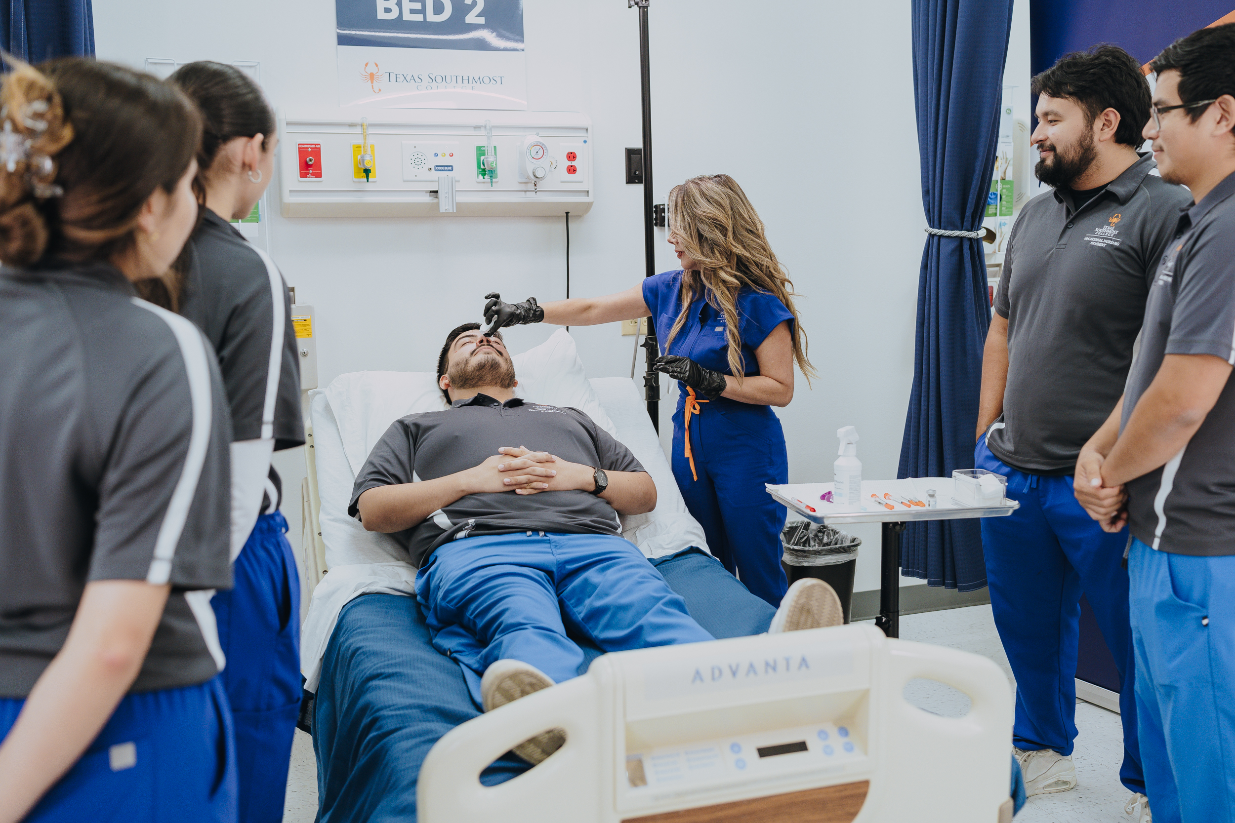 Instructor Cynthia Diaz With Students in Lab
