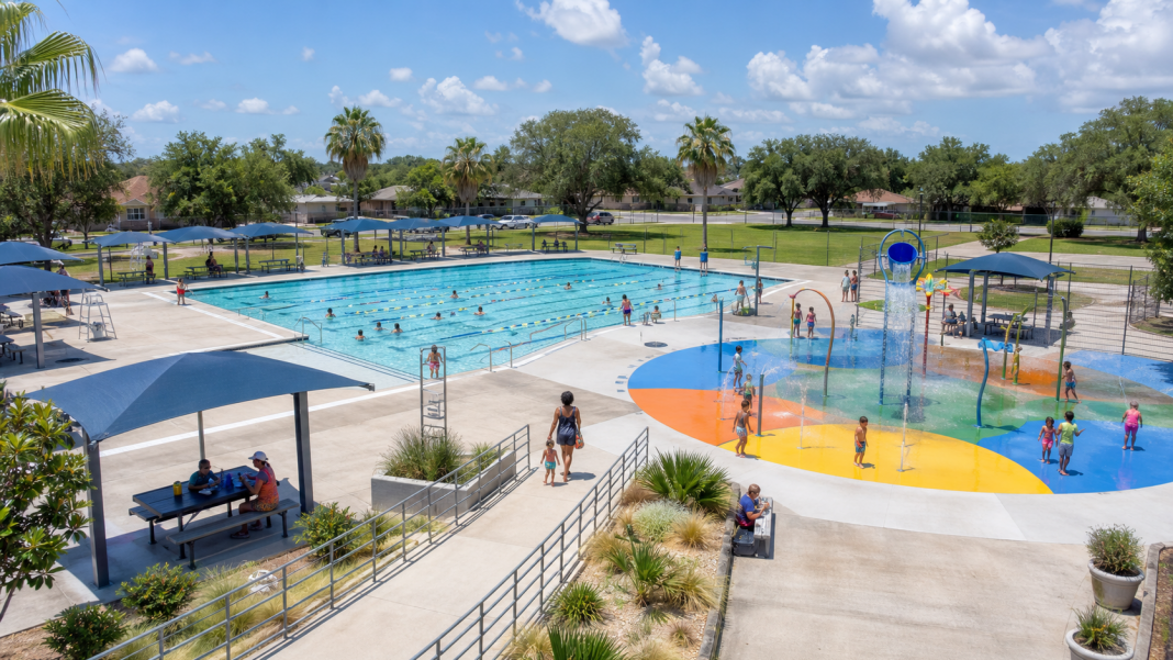 Illustration of a renovated city pool and new splash pad in a neighborhood park.