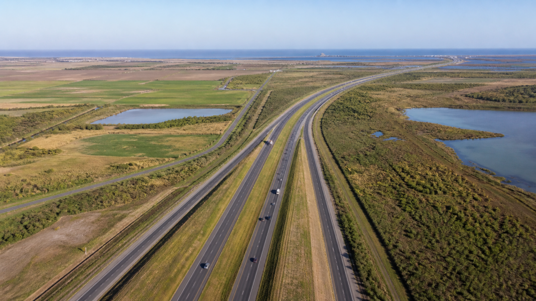 A conceptual divided highway crossing South Texas toward the coast