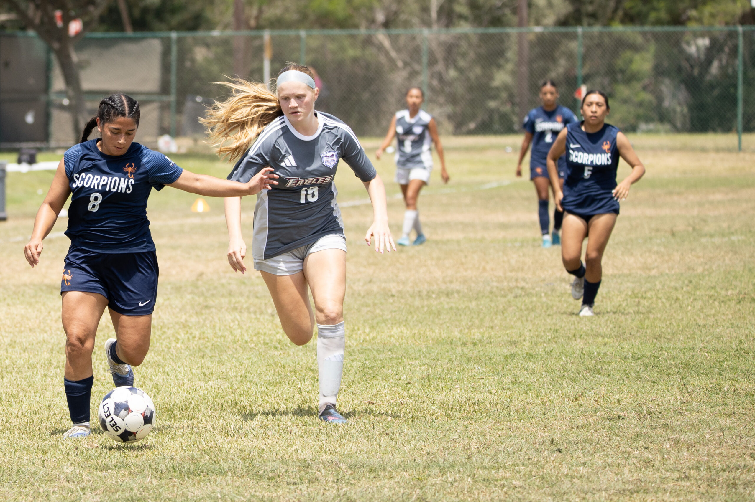 Texas Southmost College player Mia Saenz moves the ball past a Northeast Texas Community College defender.