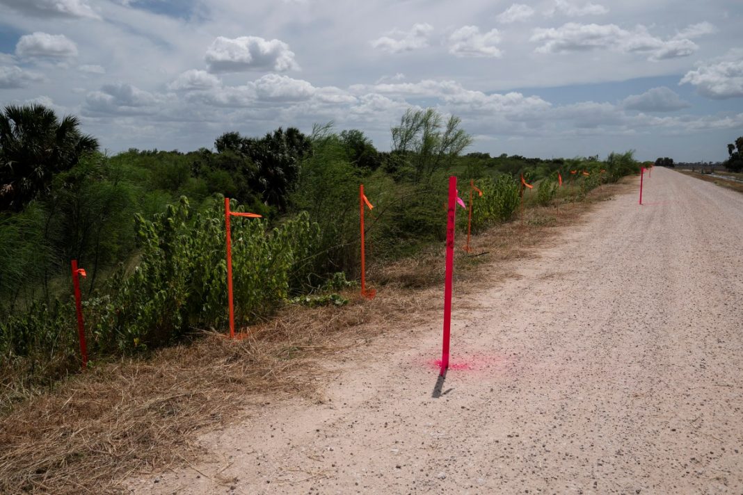 Survey stakes at the proposed border wall location near Santa Ana National Wildlife Refuge