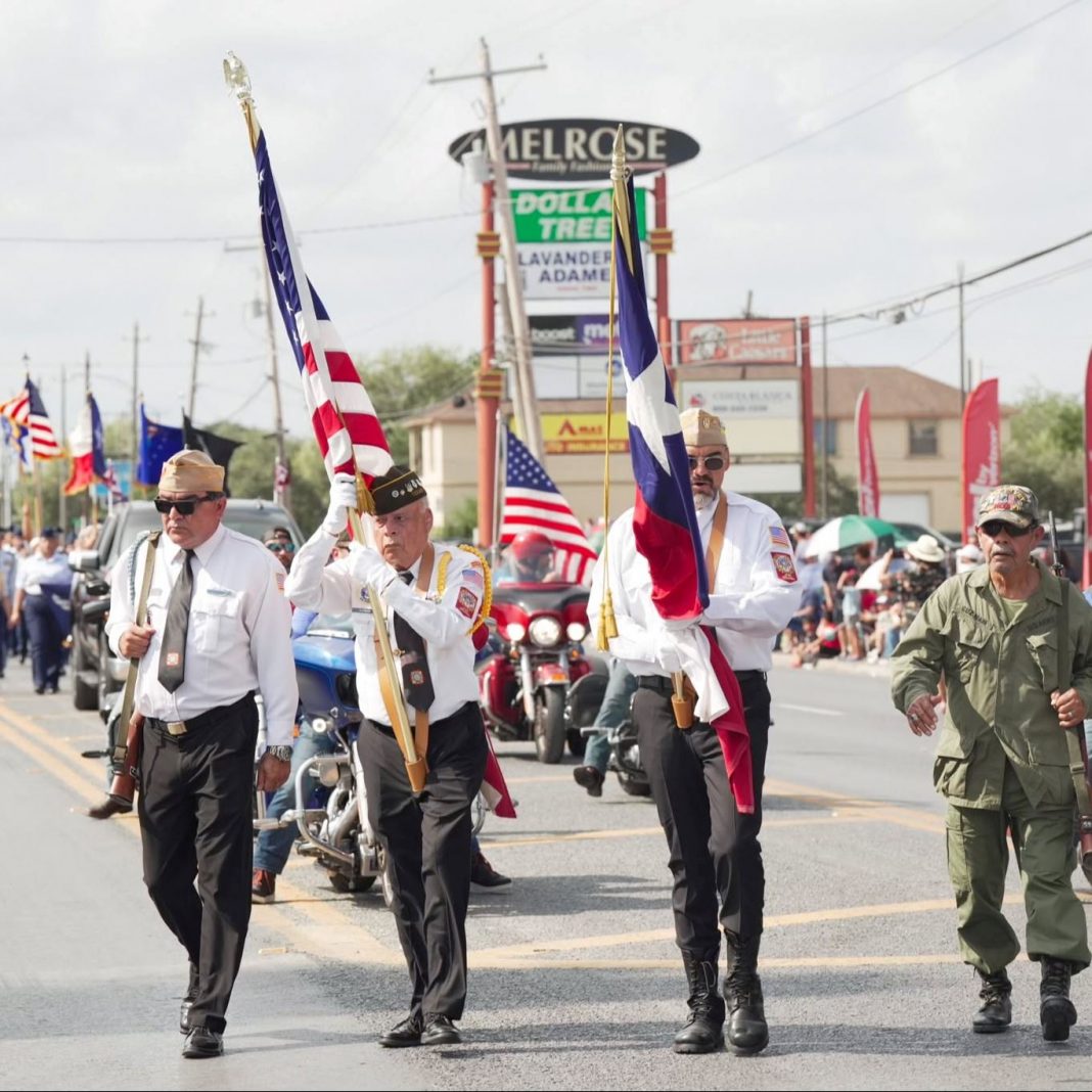 Veterans carrying flags during a Brownsville parade